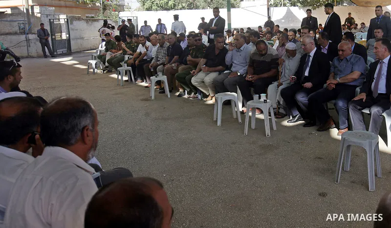 Palestinian Prime Minister Rami Hamdallah offers condolences to the Family of Palestinian Saad Dawabsha, the father of a Palestinian toddler killed last week when their home was firebombed by Jewish extremists, in Duma v...
