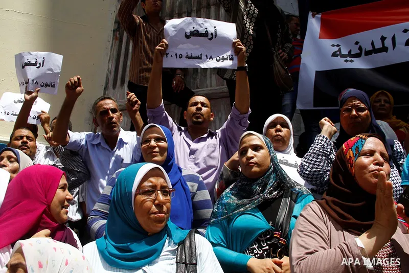 Staff and workers of Egypt's Ministry of Finance Tax Authority shout slogans against Finance Minister Hany Kadry Dimian and the government during a protest in front of the Syndicate of Journalists in Cairo, August 10, 20...