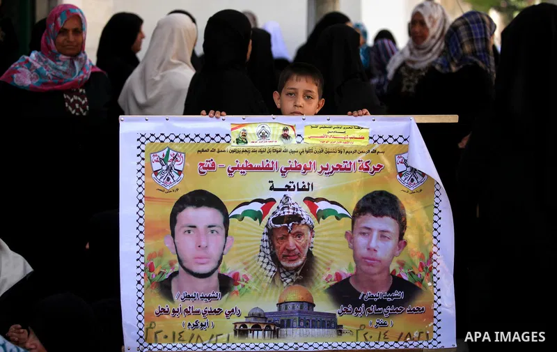 Palestinian families of martyrs take part a protest to demand their rights, in Gaza city, on August 11, 2015. Photo by Ashraf Amra