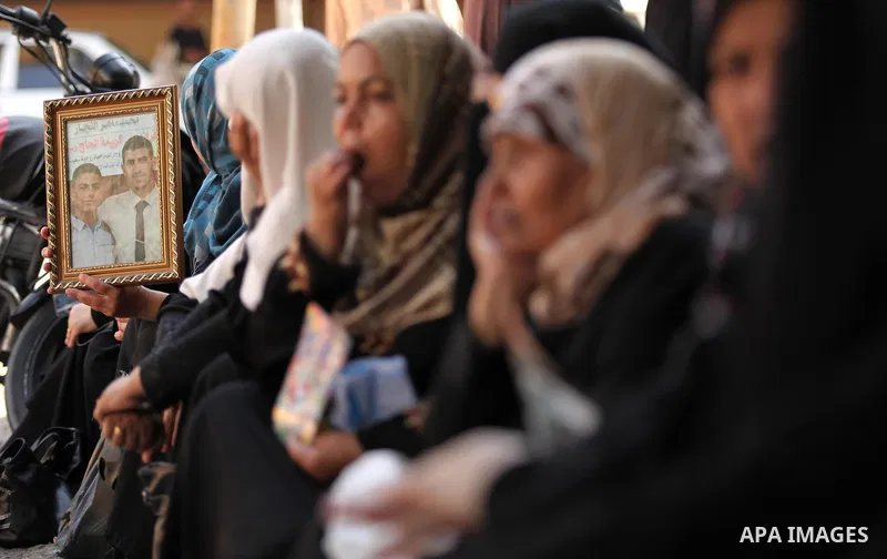 Palestinian families of martyrs take part a protest to demand their rights, in Gaza city, on August 11, 2015. Photo by Ashraf Amra