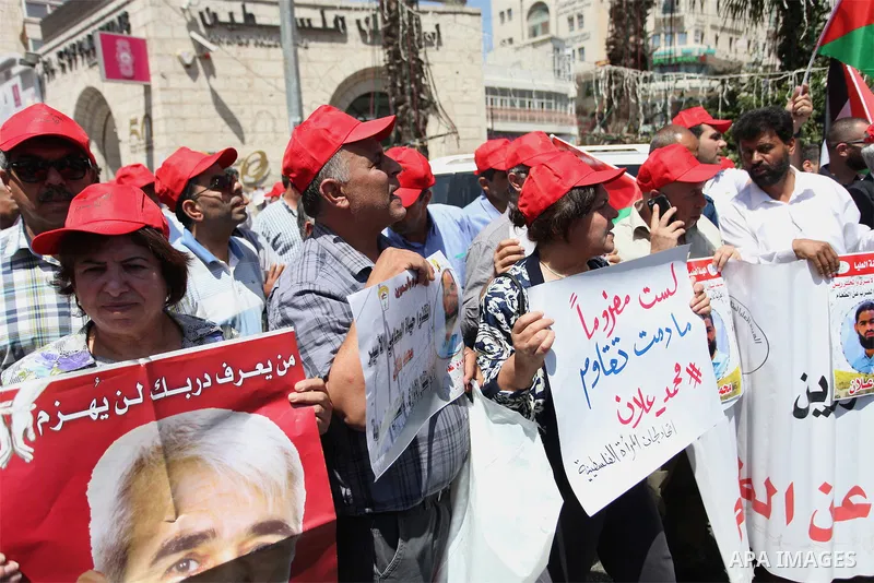 Protesters hold portraits of Palestinian prisoner in Israeli jails Mohammad Allan, during a protest in the West Bank city of Ramallah, on August 11, 2015. The Israeli military prosecutor intends to request court permissi...