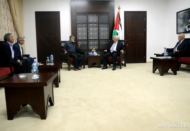President Mahmoud Abbas meets with the father of Palestinian prisoner in Israeli jails Mohammad Allan, in the West Bank city of Ramallah, August 11, 2015. Allan has been 58 days on a hungers strike protesting one year lo...