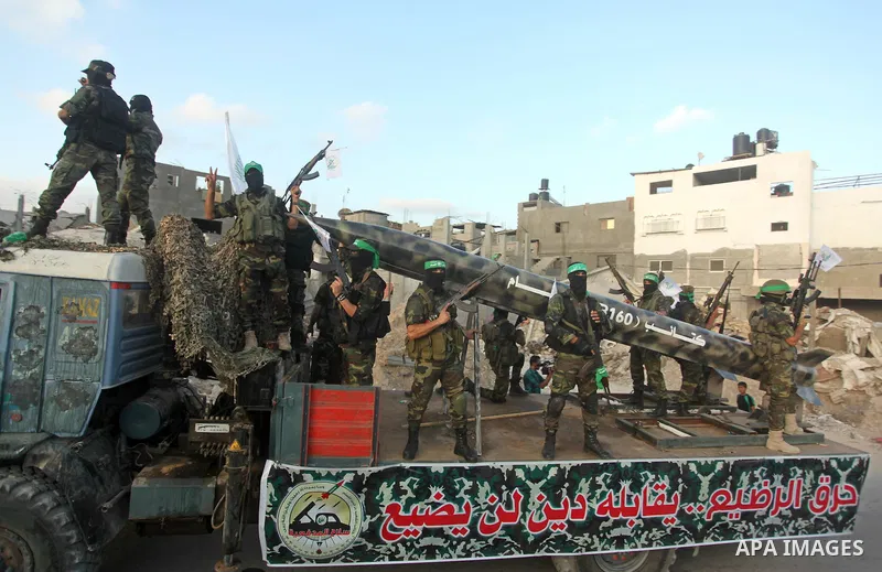 Members of Ezzedeen al-Qassam brigades, the armed wing of Hamas movement, take part in an anti-Israel parade in Beit Hanoun, in the northern Gaza Strip, on August 11, 2015. Photo by Ashraf Amra