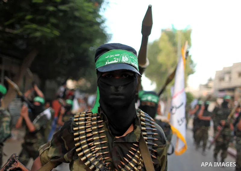 Members of Ezzedeen al-Qassam brigades, the armed wing of Hamas movement, take part in an anti-Israel parade in Beit Hanoun, in the northern Gaza Strip, on August 11, 2015. Photo by Ashraf Amra