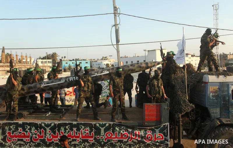 Members of Ezzedeen al-Qassam brigades, the armed wing of Hamas movement, take part in an anti-Israel parade in Beit Hanoun, in the northern Gaza Strip, on August 11, 2015. Photo by Ashraf Amra