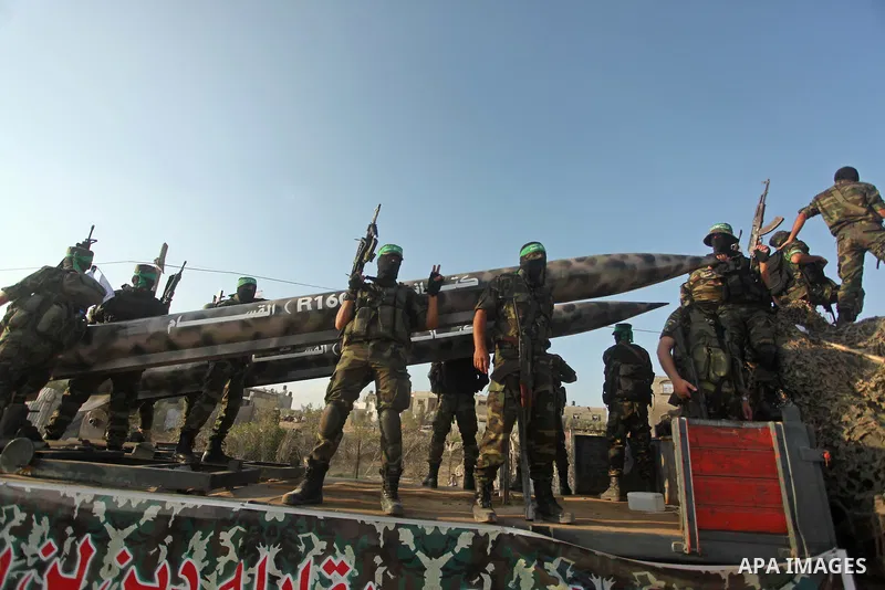 Members of Ezzedeen al-Qassam brigades, the armed wing of Hamas movement, take part in an anti-Israel parade in Beit Hanoun, in the northern Gaza Strip, on August 11, 2015. Photo by Ashraf Amra