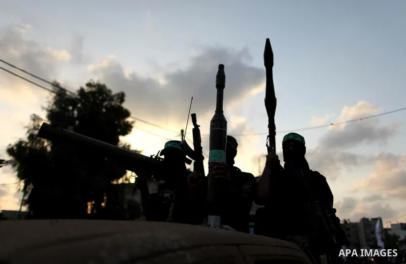 Members of Ezzedeen al-Qassam brigades, the armed wing of Hamas movement, take part in an anti-Israel parade in Beit Hanoun, in the northern Gaza Strip, on August 11, 2015. Photo by Ashraf Amra