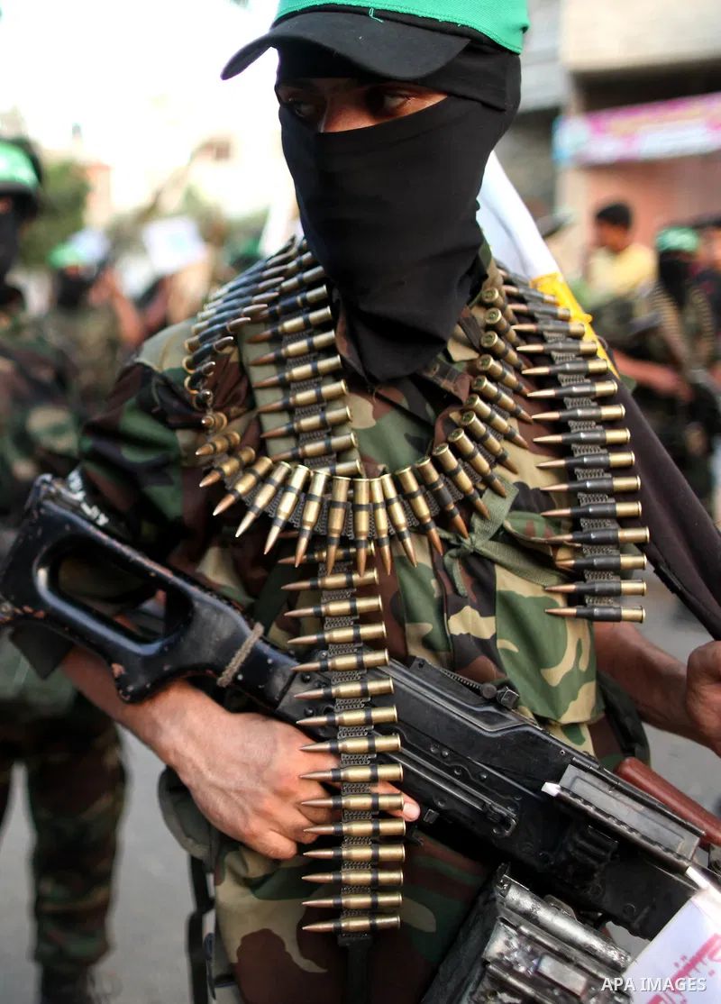 Members of Ezzedeen al-Qassam brigades, the armed wing of Hamas movement, take part in an anti-Israel parade in Beit Hanoun, in the northern Gaza Strip, on August 11, 2015. Photo by Ashraf Amra
