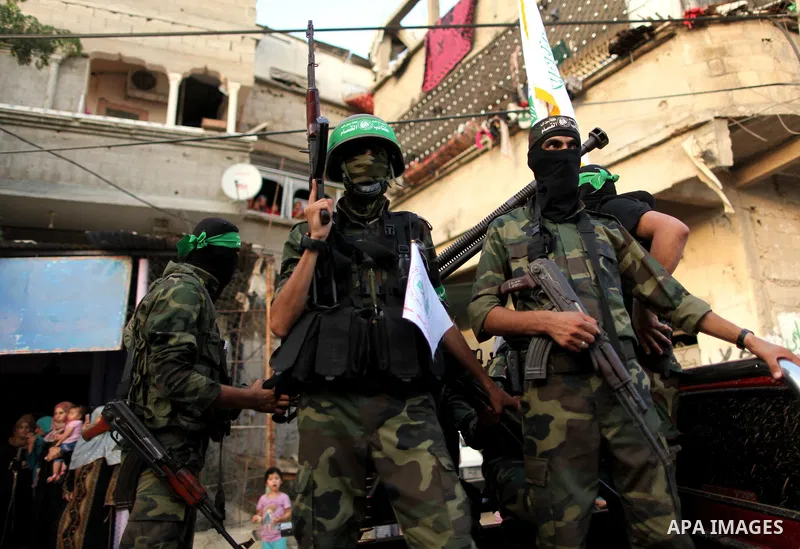 Members of Ezzedeen al-Qassam brigades, the armed wing of Hamas movement, take part in an anti-Israel parade in Beit Hanoun, in the northern Gaza Strip, on August 11, 2015. Photo by Ashraf Amra