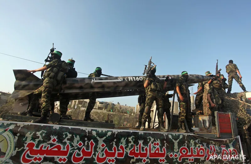 Members of Ezzedeen al-Qassam brigades, the armed wing of Hamas movement, take part in an anti-Israel parade in Beit Hanoun, in the northern Gaza Strip, on August 11, 2015. Photo by Ashraf Amra