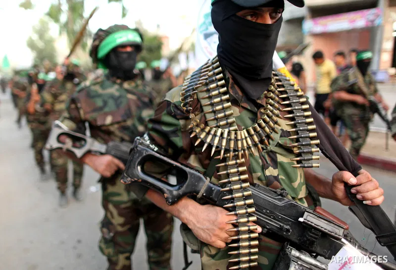 Members of Ezzedeen al-Qassam brigades, the armed wing of Hamas movement, take part in an anti-Israel parade in Beit Hanoun, in the northern Gaza Strip, on August 11, 2015. Photo by Ashraf Amra