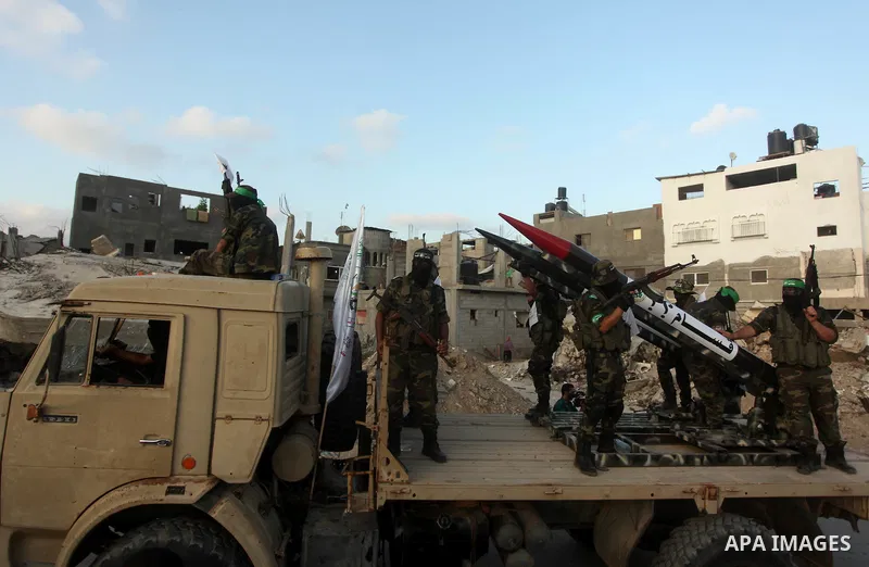 Members of Ezzedeen al-Qassam brigades, the armed wing of Hamas movement, take part in an anti-Israel parade in Beit Hanoun, in the northern Gaza Strip, on August 11, 2015. Photo by Ashraf Amra