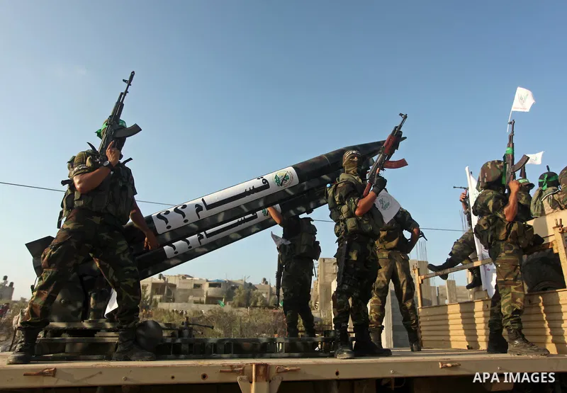 Members of Ezzedeen al-Qassam brigades, the armed wing of Hamas movement, take part in an anti-Israel parade in Beit Hanoun, in the northern Gaza Strip, on August 11, 2015. Photo by Ashraf Amra