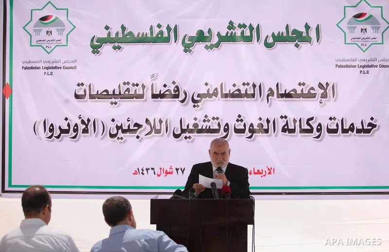 Deputy of the Legislative Council, Ahmed Bahar, speaks during a protest against the United Nations Relief and Works Agency (UNRWA), decision to reduce of the services in Gaza city on August 12, 2015. The Deputy Commissio...