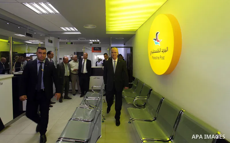 Palestinian Prime Minister Rami Hamdallah takes part in the opening of the Mowhda window office in the town of Bedo near Jerusalem on August 12, 2015. Photo by Prime Minister Office