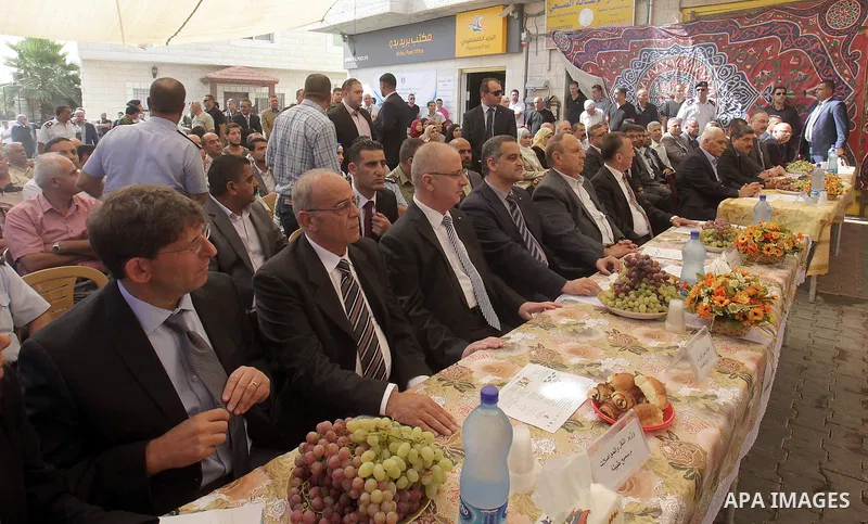 Palestinian Prime Minister Rami Hamdallah takes part in the opening of the Mowhda window office in the town of Bedo near Jerusalem on August 12, 2015. Photo by Prime Minister Office