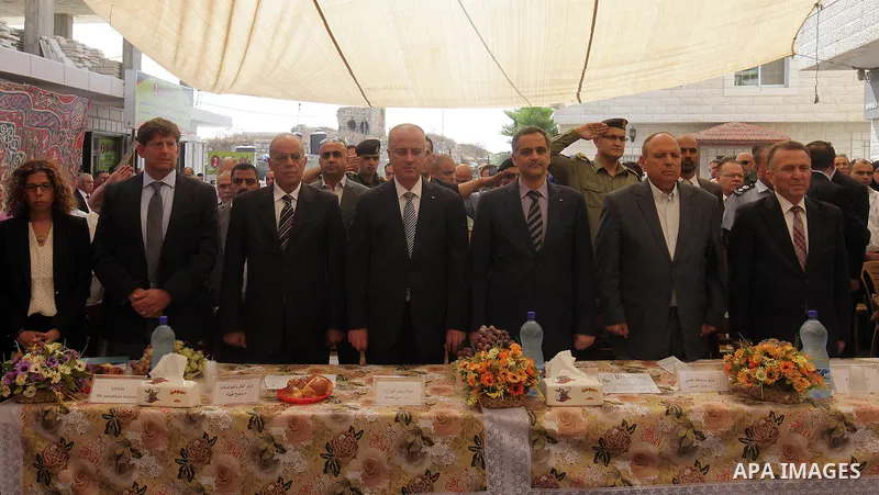 Palestinian Prime Minister Rami Hamdallah takes part in the opening of the Mowhda window office in the town of Bedo near Jerusalem on August 12, 2015. Photo by Prime Minister Office