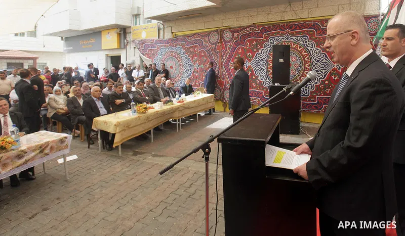 Palestinian Prime Minister Rami Hamdallah takes part in the opening of the Mowhda window office in the town of Bedo near Jerusalem on August 12, 2015. Photo by Prime Minister Office