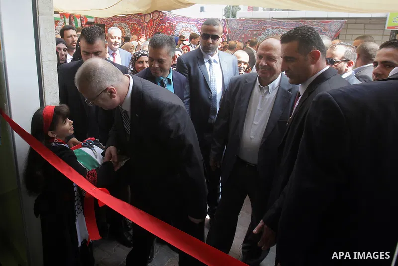 Palestinian Prime Minister Rami Hamdallah takes part in the opening of the Mowhda window office in the town of Bedo near Jerusalem on August 12, 2015. Photo by Prime Minister Office