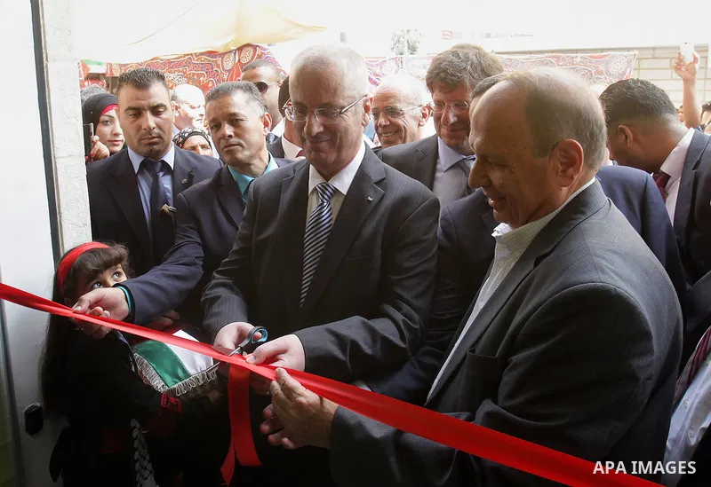 Palestinian Prime Minister Rami Hamdallah takes part in the opening of the Mowhda window office in the town of Bedo near Jerusalem on August 12, 2015. Photo by Prime Minister Office
