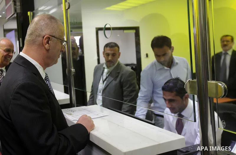 Palestinian Prime Minister Rami Hamdallah takes part in the opening of the Mowhda window office in the town of Bedo near Jerusalem on August 12, 2015. Photo by Prime Minister Office