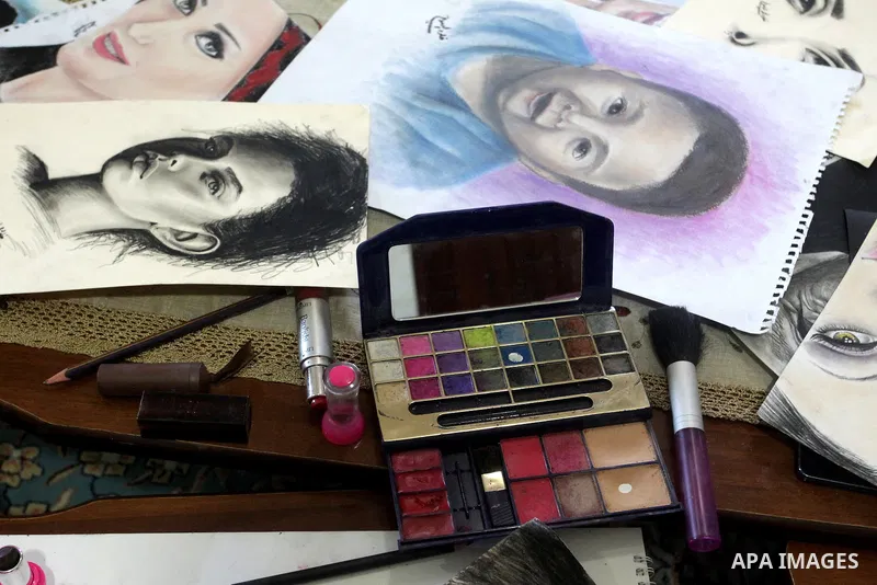 A picture taken on August 12, 2015, shows the drawings of Palestinian Kholoud El-Desouki, 23-year-old, painted using cosmetics and makeup tools, at her house in Khan Younis in the southern Gaza Strip. Artists of Gaza Str...