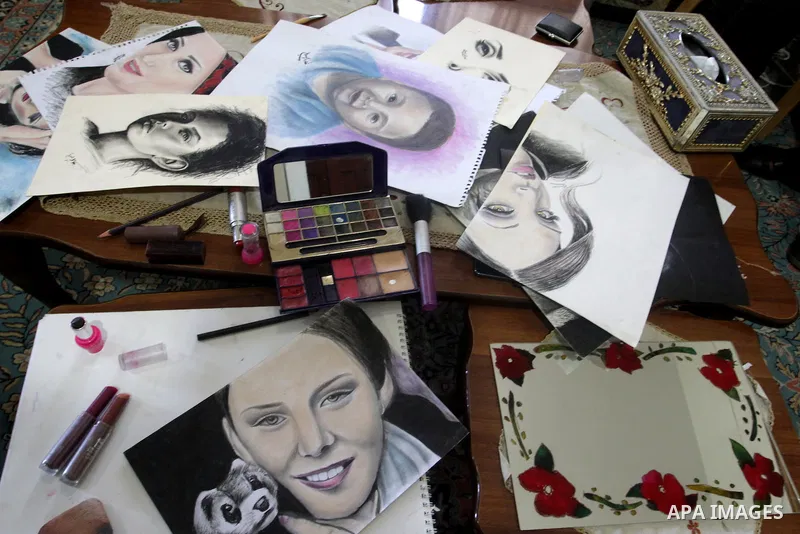 A picture taken on August 12, 2015, shows the drawings of Palestinian Kholoud El-Desouki, 23-year-old, painted using cosmetics and makeup tools, at her house in Khan Younis in the southern Gaza Strip. Artists of Gaza Str...