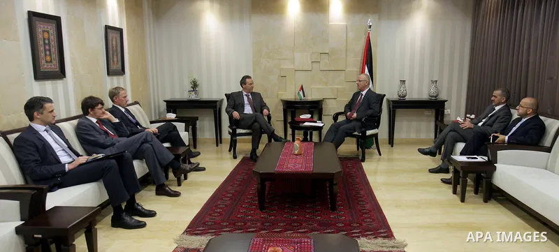 Palestinian Prime Minister Rami Hamdallah meets with Representative of the Federal Republic of Germany to the Palestine Peter Perfirt, in the West Bank city of Ramallah, on August 13, 2015. Photo by Prime Minister Office