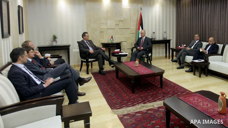 Palestinian Prime Minister Rami Hamdallah meets with Representative of the Federal Republic of Germany to the Palestine Peter Perfirt, in the West Bank city of Ramallah, on August 13, 2015. Photo by Prime Minister Office