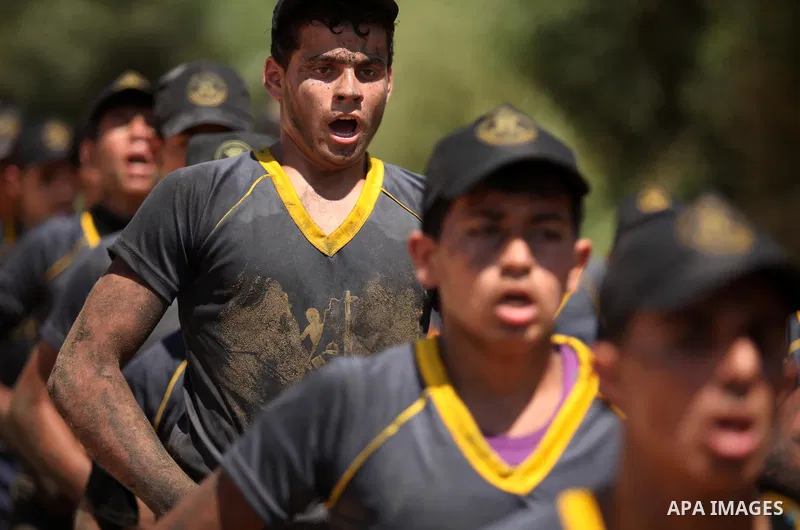 Palestinian youths take part in a military-style exercise during a summer camp organized by Islamic Jihad movement, in Gaza city, on August 13, 2015. Photo by Ashraf Amra