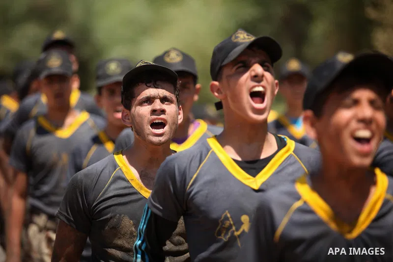 Palestinian youths take part in a military-style exercise during a summer camp organized by Islamic Jihad movement, in Gaza city, on August 13, 2015. Photo by Ashraf Amra