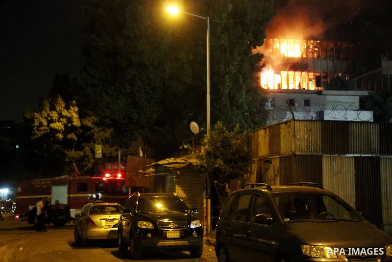 Egyptian firefighters try to extinguish the fire from broke out in El-Ataba call center, in Cairo on August 13, 2015. The fire broke out in the upper four levels of the eight-storey building in downtown Cairo leaving no...