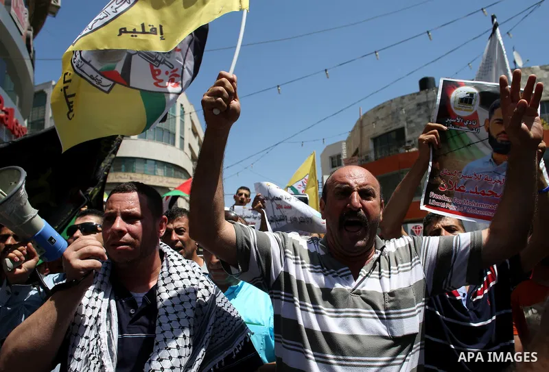 Protesters participate in a demonstration supporting the Palestinian prisoner in Israeli jails Mohammad Allan, during a protest in the West Bank city of Nablus, on August 14, 2015. The Israeli military prosecutor intends...