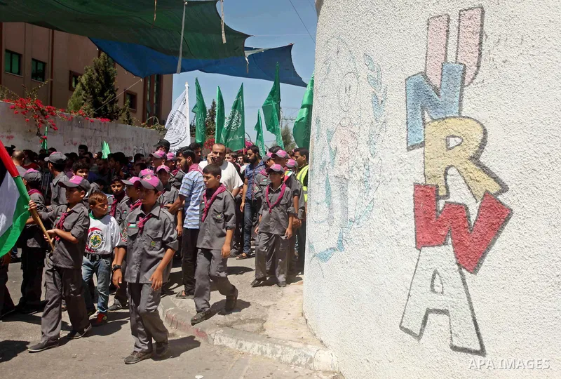 Palestinians take part in a protest against the reduction of educational programs given by the United Nations Relief and Works Agency (UNRWA) outside the UNRWA headquarters in Gaza city on August 14, 2015 . The UNRWA war...