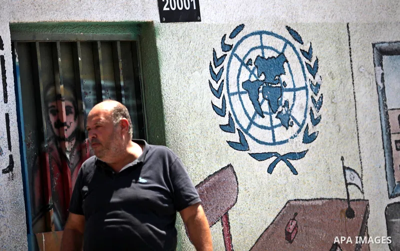 Palestinians take part in a protest against the reduction of educational programs given by the United Nations Relief and Works Agency (UNRWA) outside the UNRWA headquarters in Gaza city on August 14, 2015 . The UNRWA war...