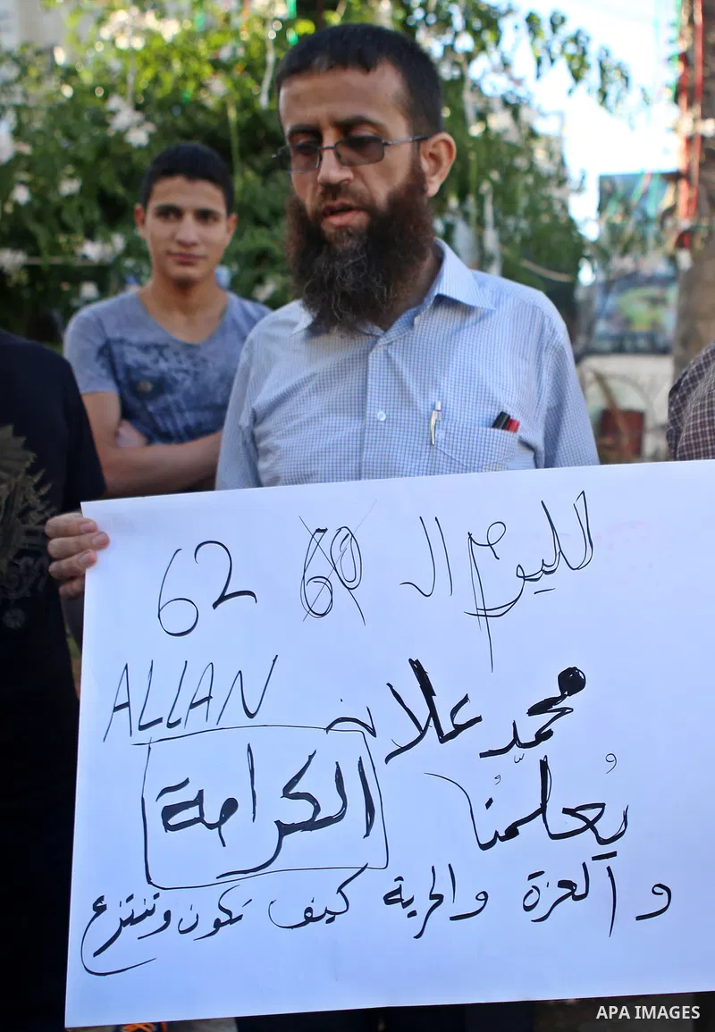 Freed prisoner Khader Adnan participates in a demonstration supporting the Palestinian prisoner in Israeli jails Mohammad Allan, during a protest in the West Bank city of Ramallah, on August 14, 2015. The Israeli militar...