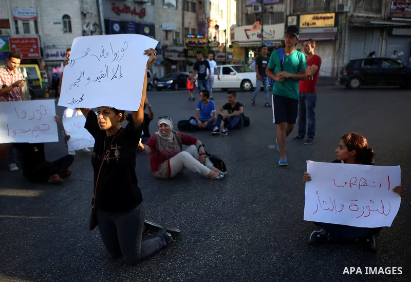 Protesters participate in a demonstration supporting the Palestinian prisoner in Israeli jails Mohammad Allan, during a protest in the West Bank city of Ramallah, on August 14, 2015. The Israeli military prosecutor inten...
