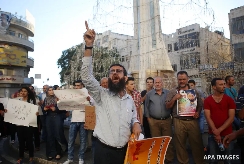 Freed prisoner Khader Adnan participates in a demonstration supporting the Palestinian prisoner in Israeli jails Mohammad Allan, during a protest in the West Bank city of Ramallah, on August 14, 2015. The Israeli militar...