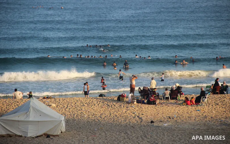 Palestinians enjoy the beach of the Mediterranean Sea on the coast of Gaza City on August 14, 2015. Photo by Khaled Dawood