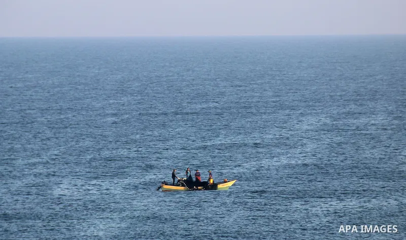 Palestinians ride a boat in the Mediterranean Sea on the coast of Gaza City on August 14, 2015. Photo by Khaled Dawood