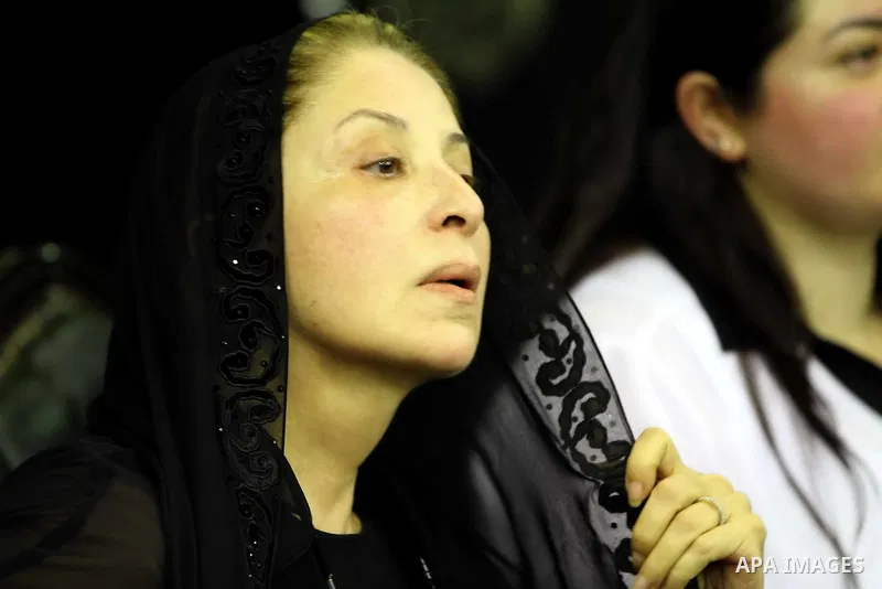 Poussie, the widow of Egyptian film star Nur al-Sharif, attends the funeral of her husband on August 14, 2015, at Omar Makram Mosque, in Cairo. The veteran pan-Arab film and TV star died on August 11, 2015 following a br...
