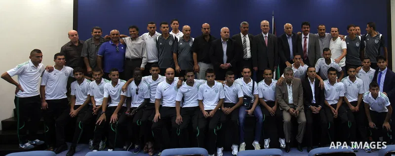 Palestinian Prime Minister Rami Hamdallah meets with Gaza Strip's Shejaiya's players, in the West Bank city of Ramallah, on August 15, 2015. Photo by Prime Minister Office