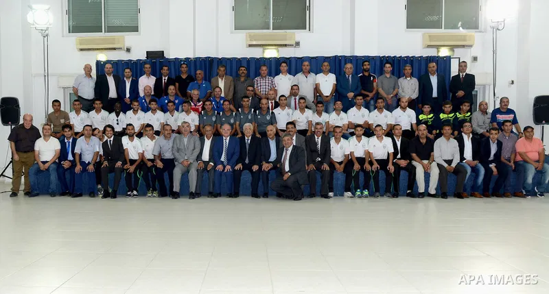 Palestinian President, Mahmoud Abbas (Abu Mazen) meets with Gaza Strip's Shejaiya's players and Hebron's Al-Ahly's players, in the West Bank city of Ramallah, on August 15, 2015. Photo by Osama Falah