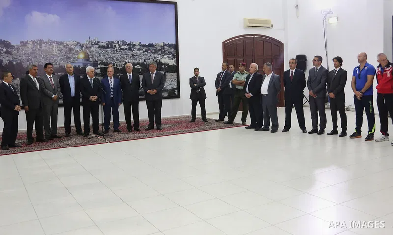 Palestinian President, Mahmoud Abbas (Abu Mazen) meets with Gaza Strip's Shejaiya's players and Hebron's Al-Ahly's players, in the West Bank city of Ramallah, on August 15, 2015. Photo by Osama Falah