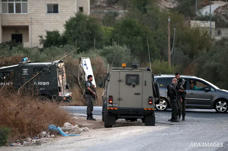 Israeli security forces take a position during clashes with Palestinian protesters following killed of Rafiq Kamel Al-Taj, in the West Bank village of Beta near Nablus City on August 15, 2015. A police spokesperson said...