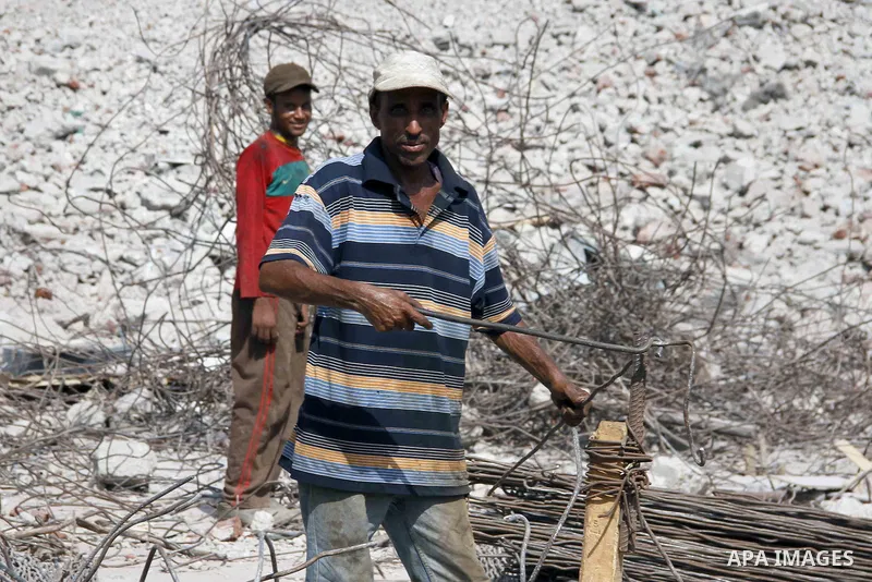 Egyptian laborers work during the demolition of the headquarters of the once-dominant party of ex-president Hosni Mubarak that was torched during the 2011 uprising that toppled him, on August 16, 2015 in the capital, Cai...
