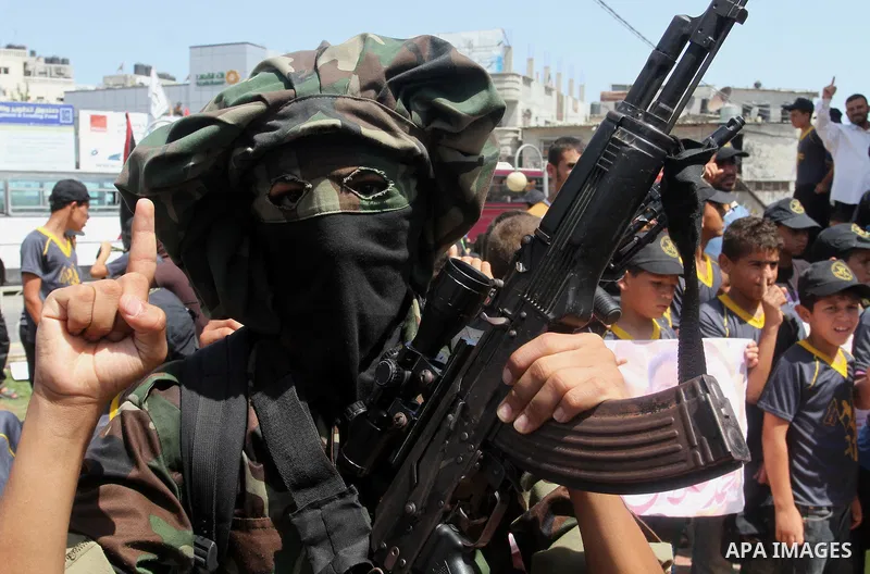 Members of Islamic Jihad take part in a protest to solidarity with prisoner Mohammad Allan allegedly being held in an Israeli jail, in Rafah in the southern Gaza Strip on August 16, 2015. Allan has been on hunger strike...