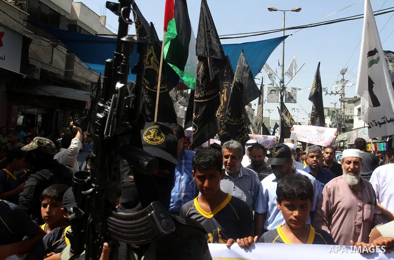 Members of Islamic Jihad take part in a protest to solidarity with prisoner Mohammad Allan allegedly being held in an Israeli jail, in Rafah in the southern Gaza Strip on August 16, 2015. Allan has been on hunger strike...