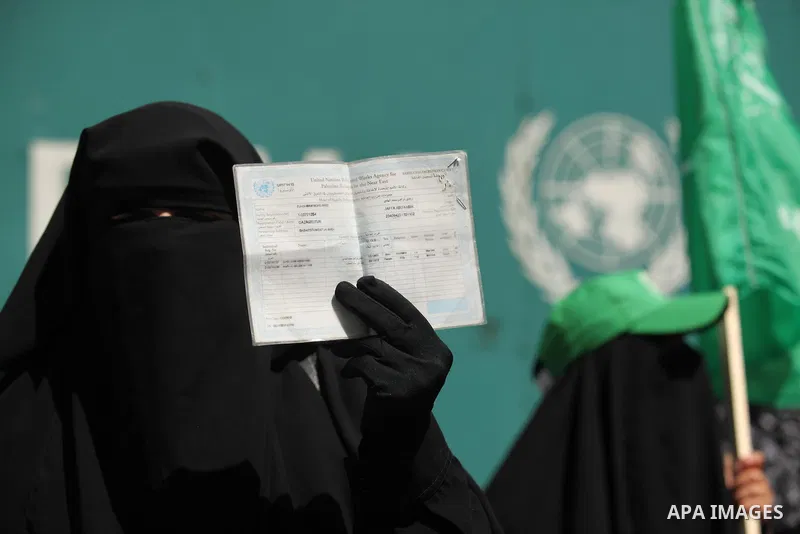 Palestinian women take part in a protest against possible reductions of the services and aid offered by United Nations Relief and Works Agency (UNRWA), in front of UNRWA headquarters in Gaza City August 16, 2015. Photo b...