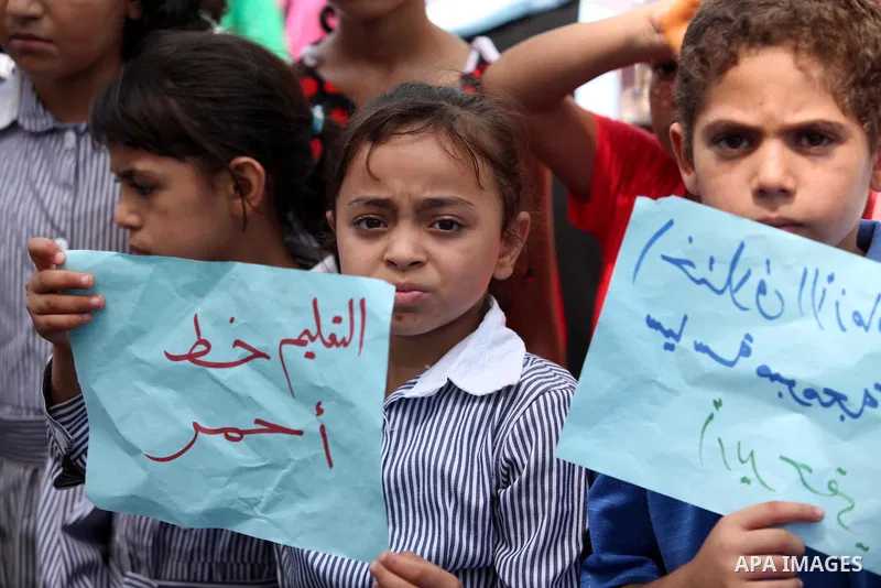 Palestinian women take part in a protest against possible reductions of the services and aid offered by United Nations Relief and Works Agency (UNRWA), in front of UNRWA headquarters in Gaza City August 16, 2015. Photo b...